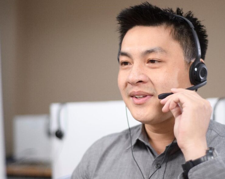 Man talking to a customer over headset