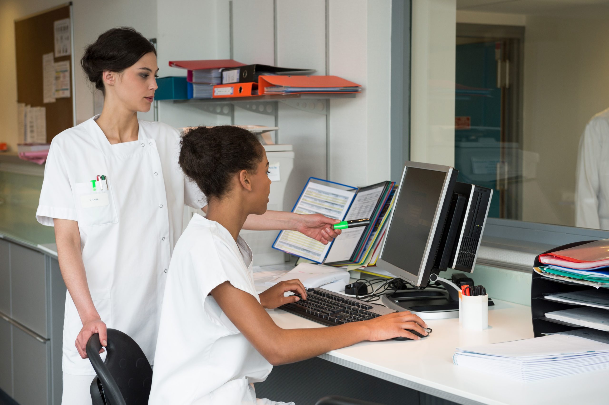 Female nurses working in office